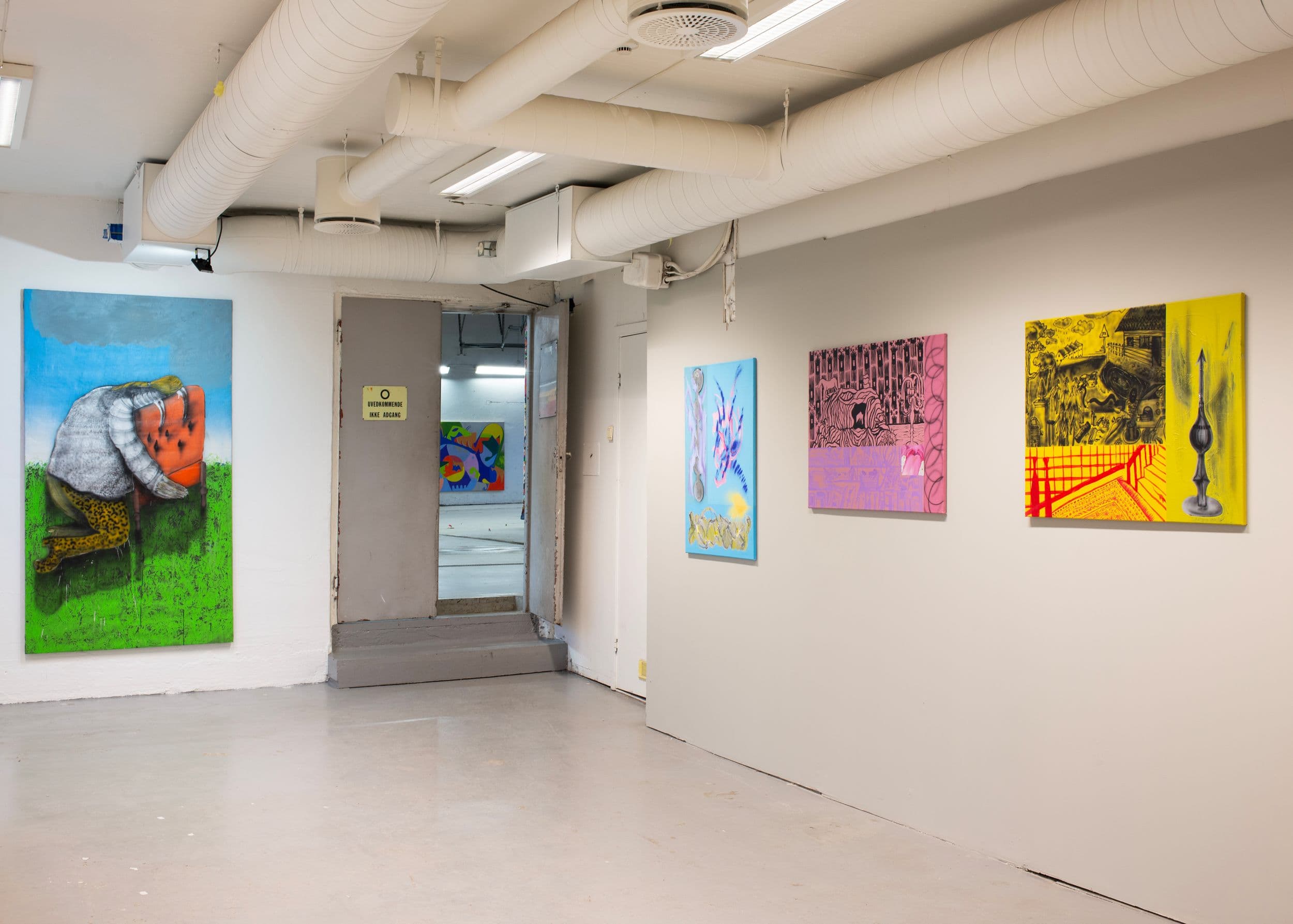 Four colorful paintings hang on the white walls of a gallery, with an open doorway leading to another room and a sign that reads "UVEDKOMMENDE IKKE ADGANG."